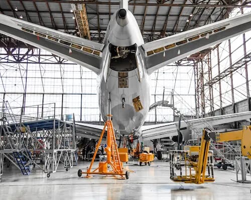 tail view of passenger plain in hangar